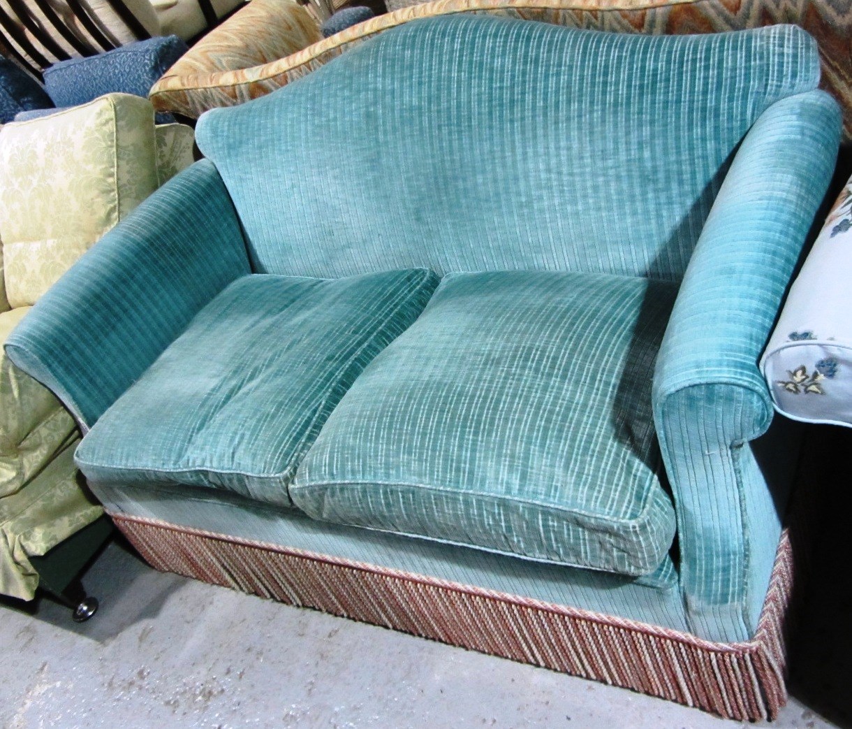 Appraisal: A th century two seat sofa upholstered in turquoise stripe