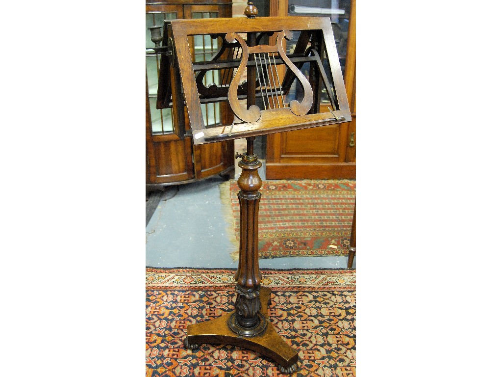 Appraisal: Regency rosewood adjustable duet music stand having shaped rests raised