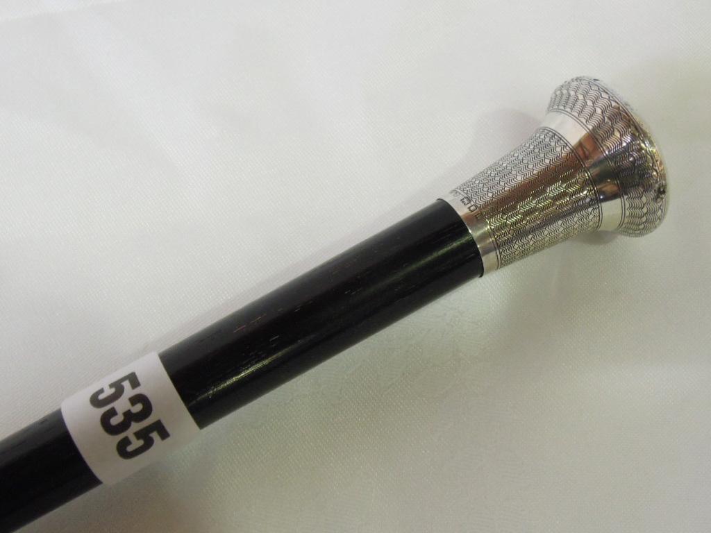 Appraisal: A gentleman's ebony cane with silver engine turned knop