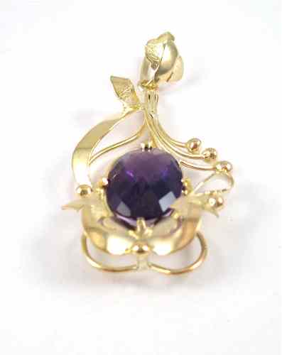 Appraisal: AMETHYST AND FOURTEEN KARAT GOLD PENDANT the large pendant features