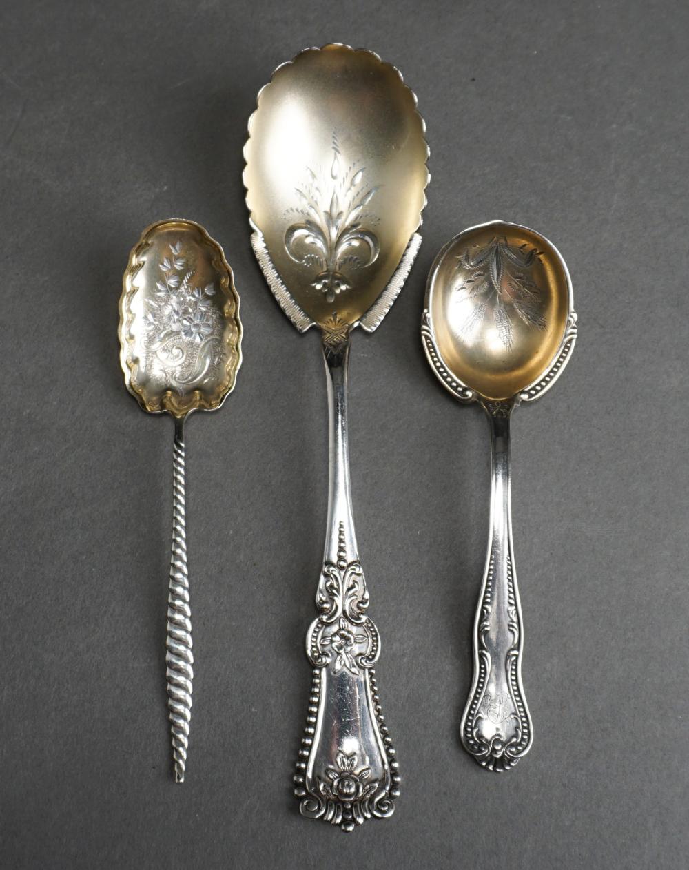 Appraisal: THREE PARTIAL GILT STERLING SILVER SERVING SPOONS OZTThree Partial Gilt