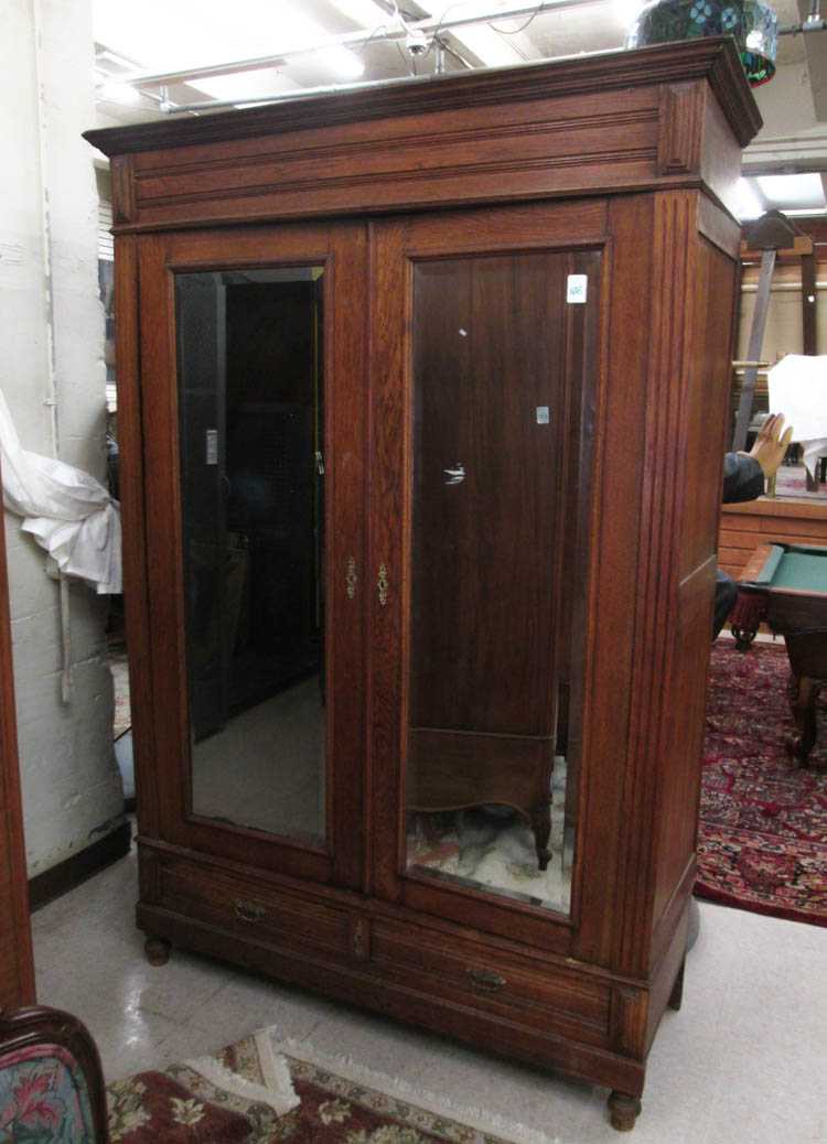 Appraisal: TWO-DOOR OAK ARMOIRE French late th century featuring two mirror-panel