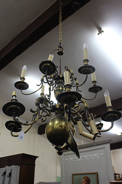 Appraisal: A LARGE TWO TIER DUTCH STYLE BRASS TWELVE LIGHT ELECTROLIER