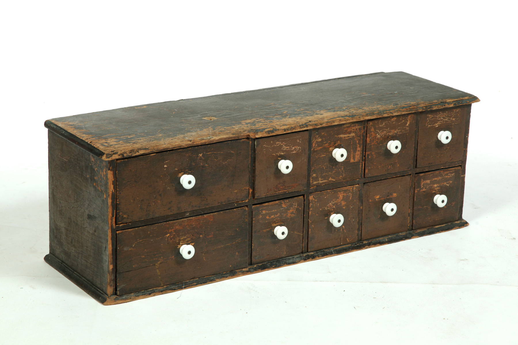 Appraisal: AMERICAN APOTHECARY OR HARDWARE CHEST Nineteenth century pine Two long