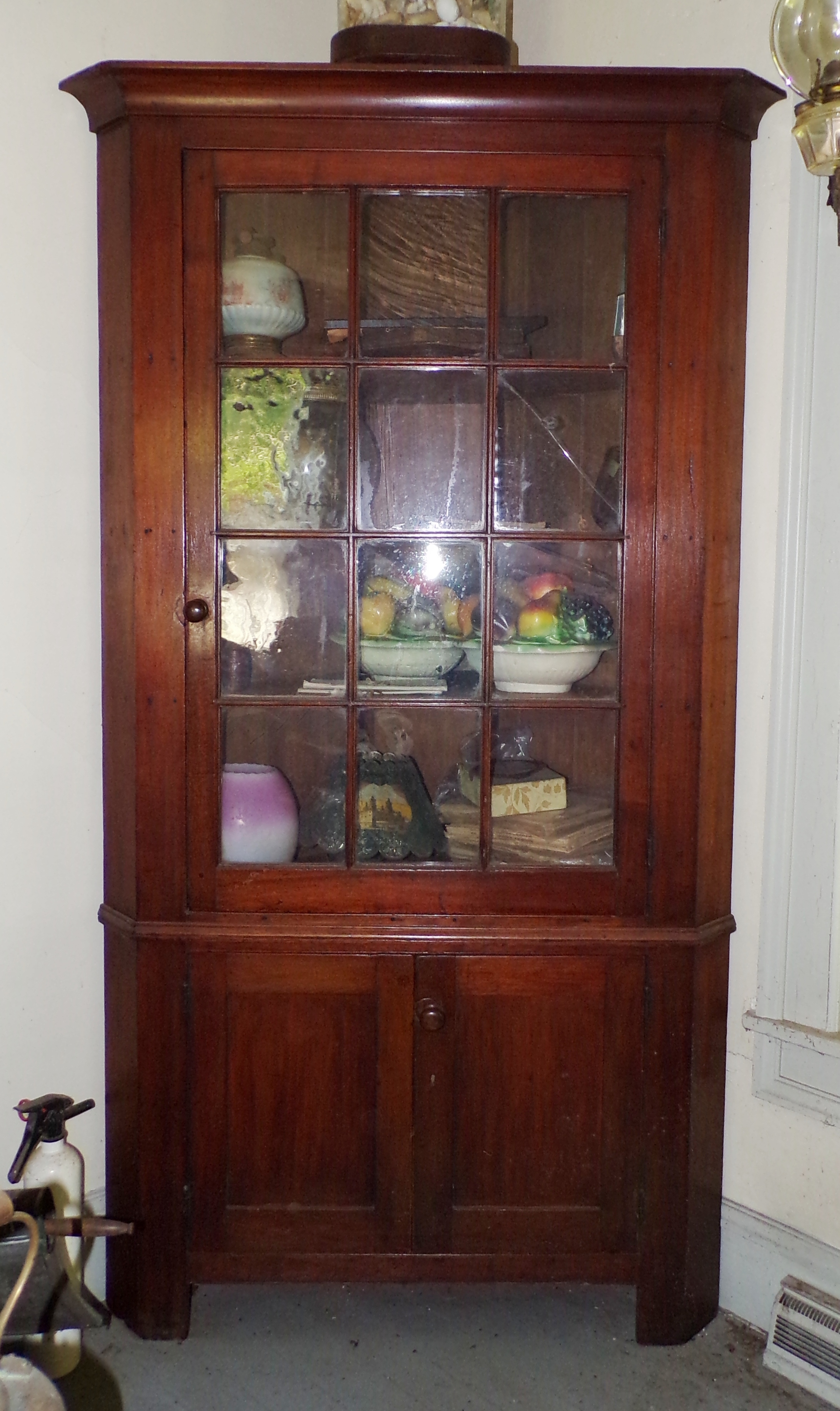 Appraisal: light walnut corner cupboard ca pane door over doors x