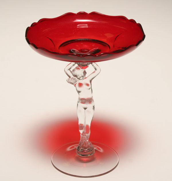 Appraisal: Cambridge nude figural ruby glass compote the red glass bowl