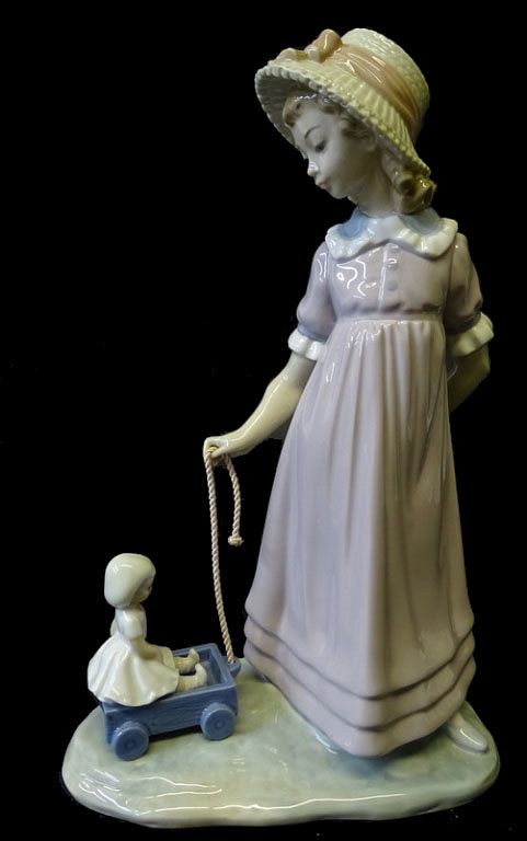 Appraisal: Lladro Pulling Dolls Carriage Porcelain Lladro Pulling Dolls Carriage Porcelain