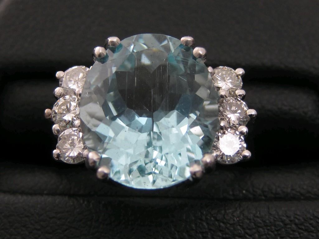 Appraisal: An Aquamarine and Diamond Ring claw-set large oval-cut aquamarine approx