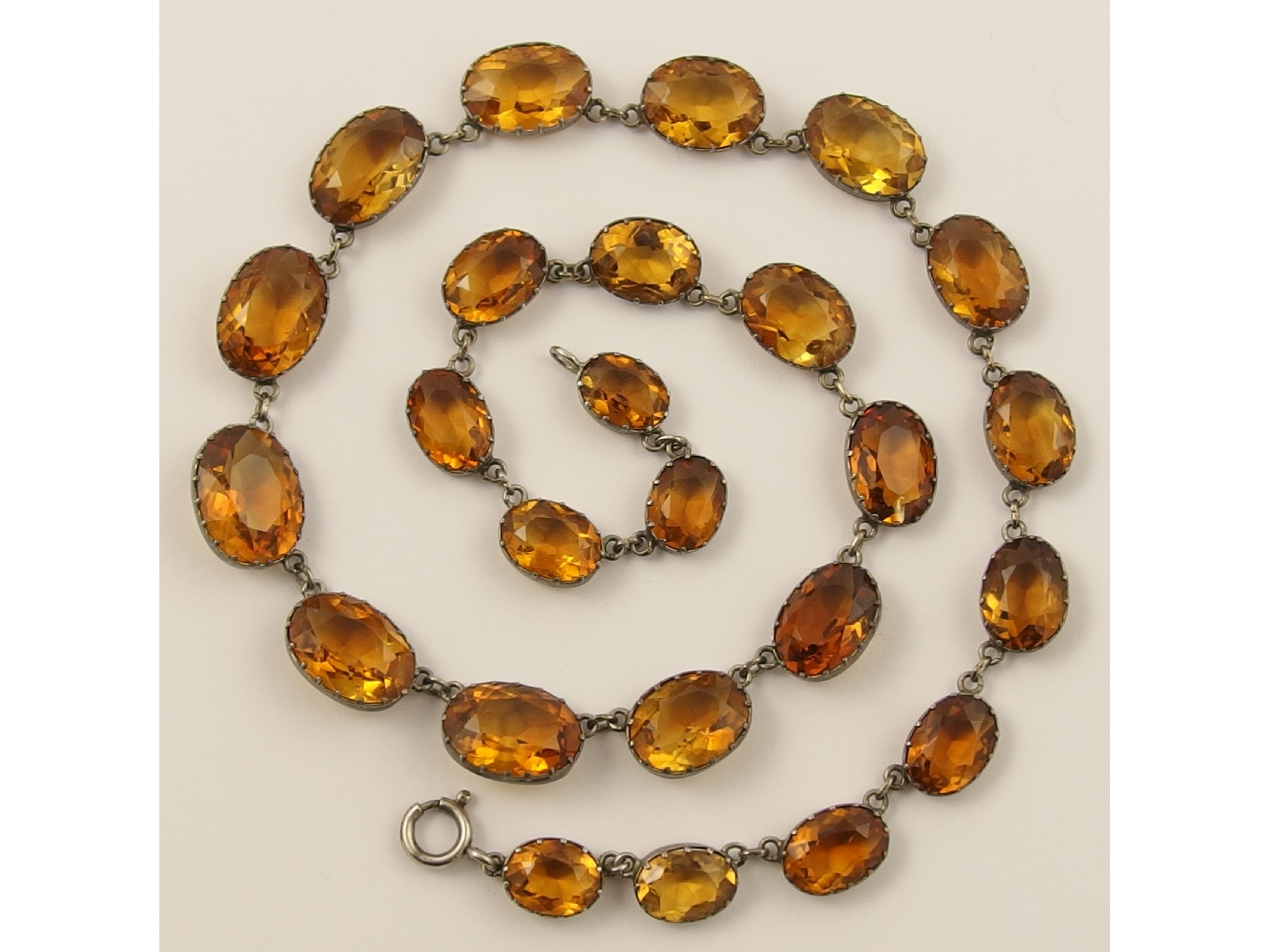 Appraisal: A silver graduated citrine necklace