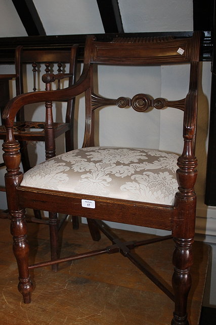 Appraisal: A REGENCY MAHOGANY ELBOW CHAIR with upholstered drop-in seat