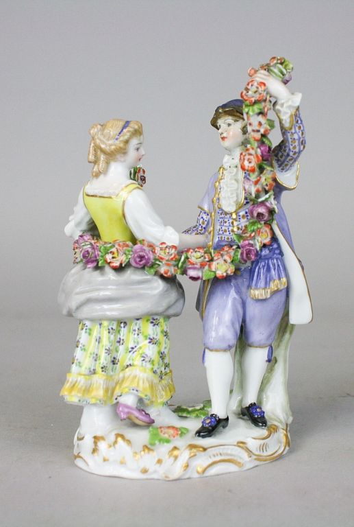 Appraisal: Meissen Porcelain Figurine Couple With Garland Porcelain figurine of a