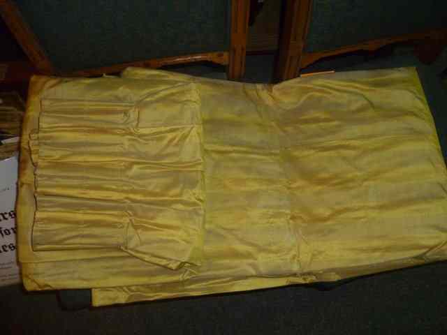 Appraisal: ONE PAIR OF YELLOW SILK LINED CURTAINS with ft drop