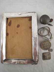 Appraisal: A silver picture frame AF together with two other pieces