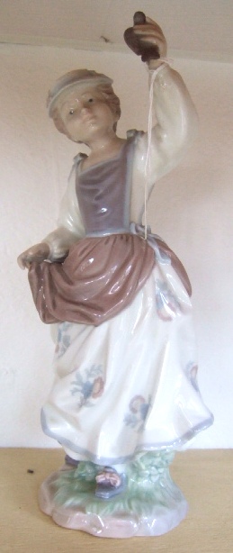 Appraisal: A Lladro figure of a Girl and Sparrow figure number