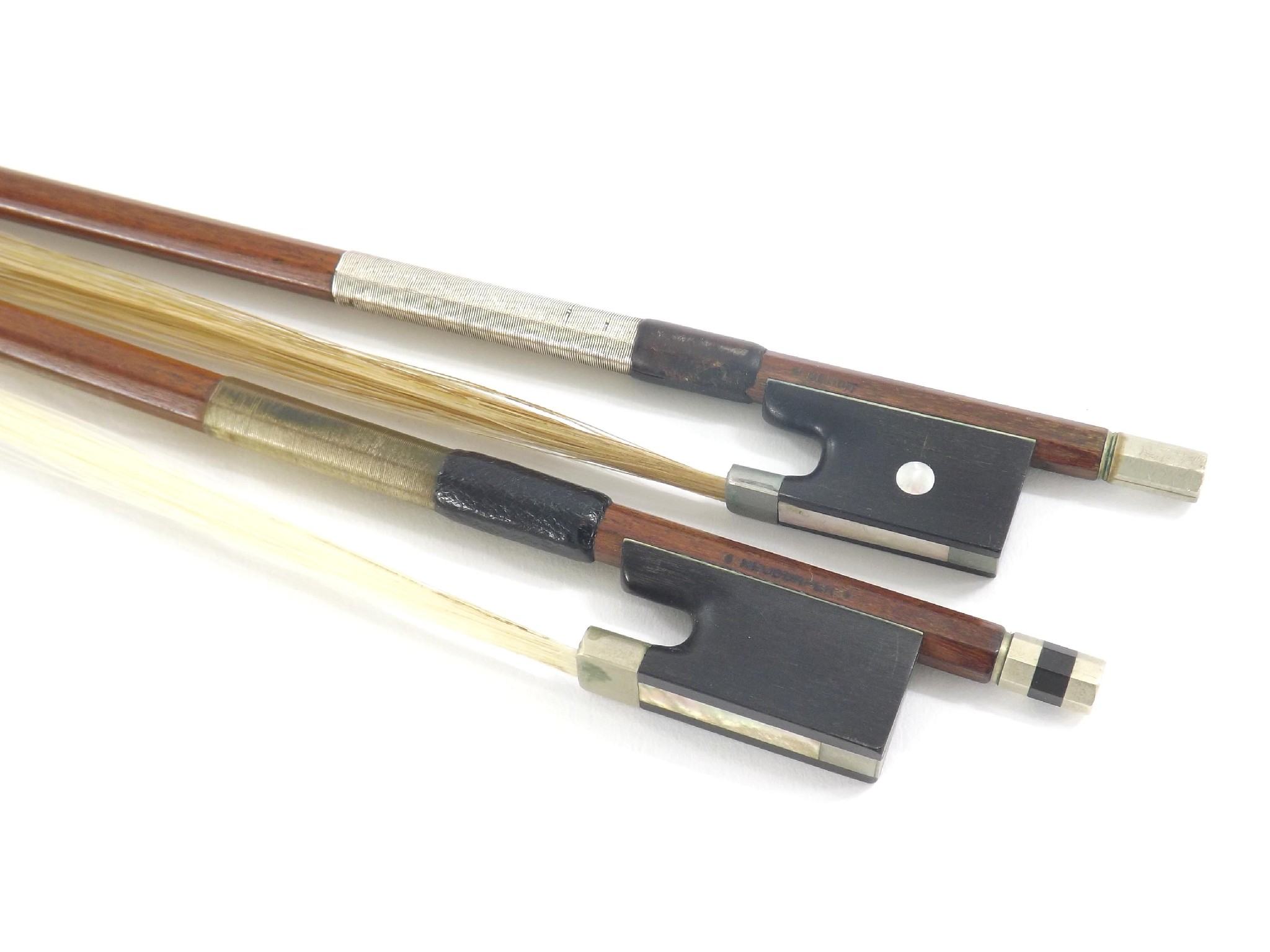 Appraisal: Two nickel mounted violin bows stamped V Benoit Neudorfer