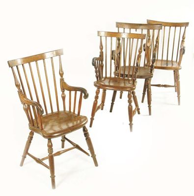 Appraisal: A near set of four th century mahogany armchairs each