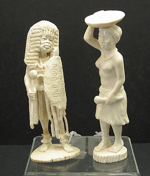 Appraisal: Two African carved ivory figures th century The first male