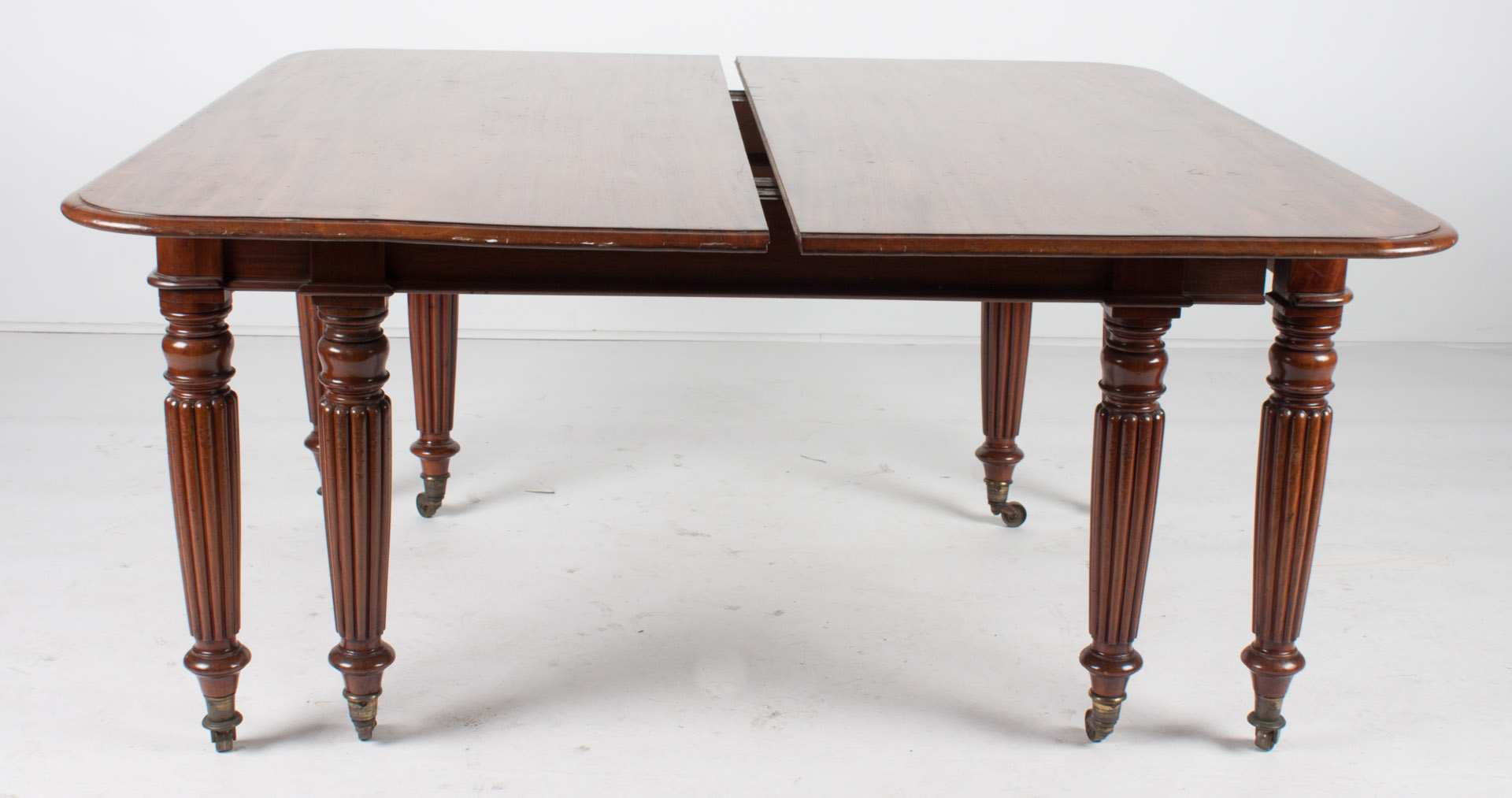 Appraisal: George IV mahogany banquet table circa reeded legs ending in