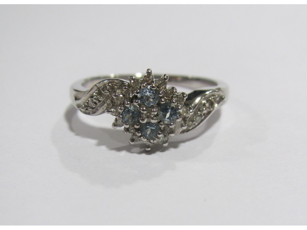 Appraisal: White gold blue topaz and diamond cluster ring