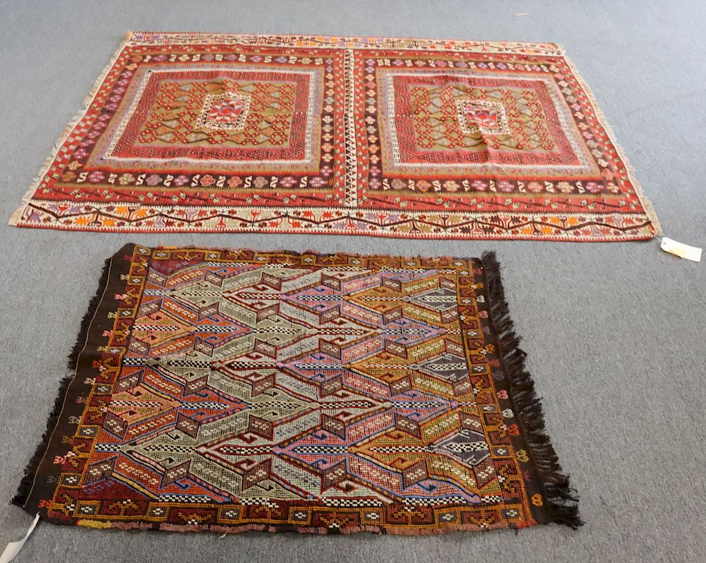 Appraisal: Two Hand Woven Rugs To include two colorful rugs From