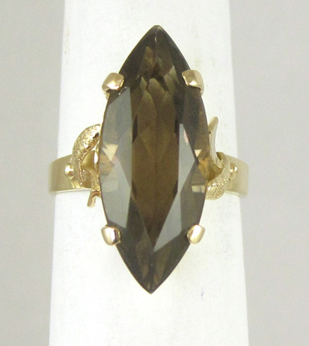 Appraisal: SMOKY QUARTZ AND FOURTEEN KARAT GOLD RING set with a