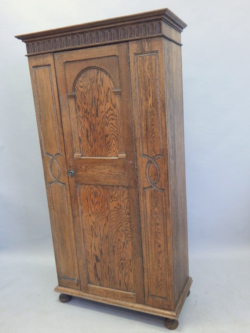 Appraisal: An early thC Continental walnut cupboard carved overall with leaves