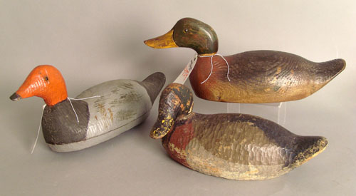 Appraisal: Three carved and painted duck decoys