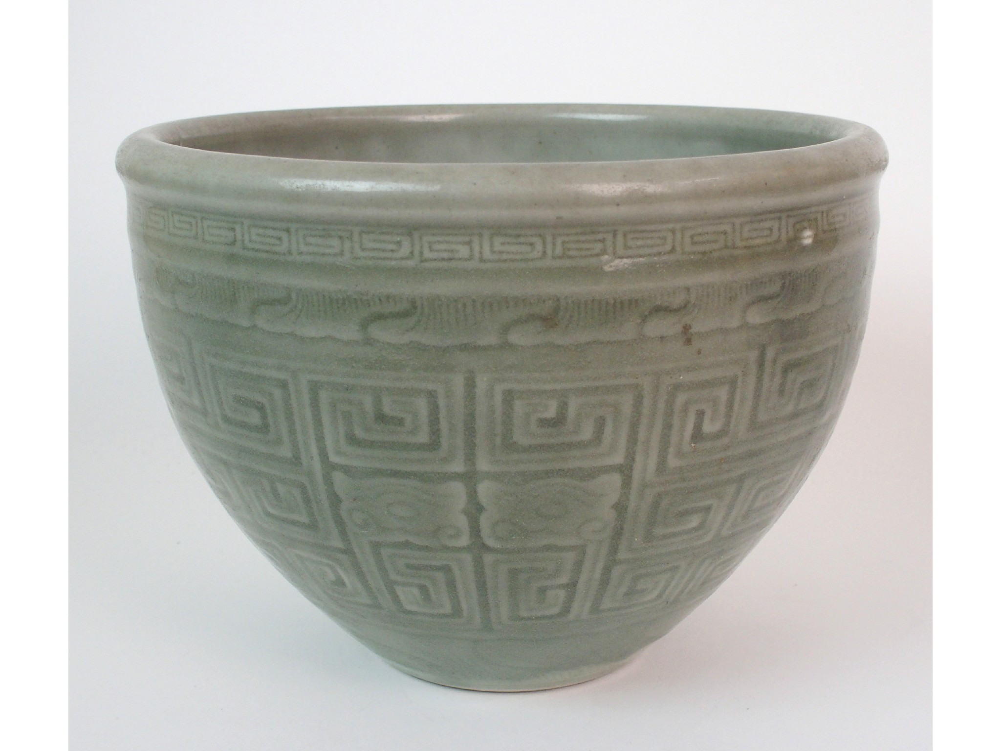 Appraisal: A Chinese celadon jardiniereincised with key pattern and taotie masks