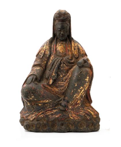 Appraisal: Chinese gilded black limestone Quanyin late ming dynasty The single