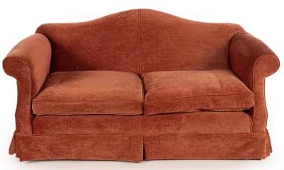 Appraisal: An upholstered camel back sofa fitted loose seat cushions cm