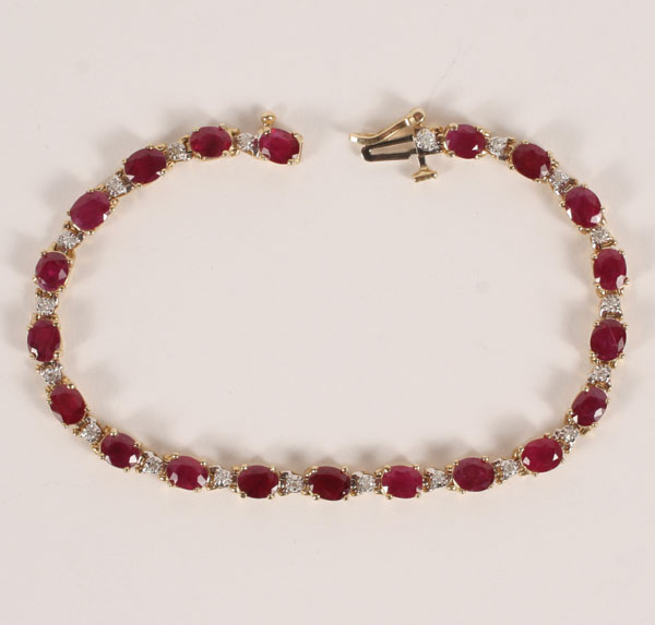 Appraisal: Gold K bracelet with oval rubies measuring mm x mm