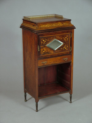 Appraisal: An Edwardian rosewood and inlaid music cabinet the top with