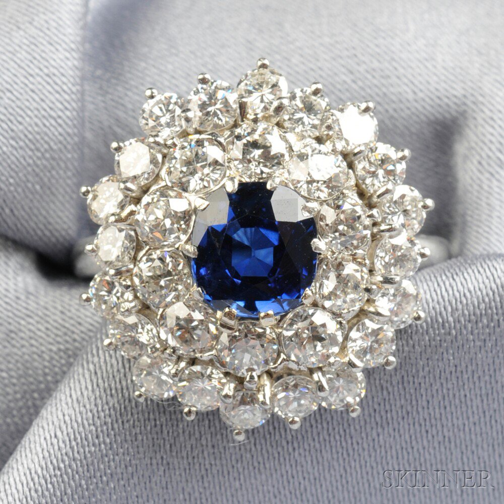 Appraisal: Platinum Sapphire and Diamond Ring centering a cushion-cut sapphire measuring