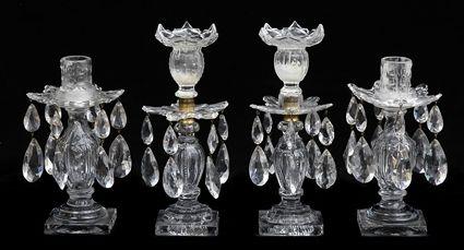 Appraisal: TWO PAIRS OF GEORGE III-STYLE CUT-GLASS CANDLESTICKS The larger with