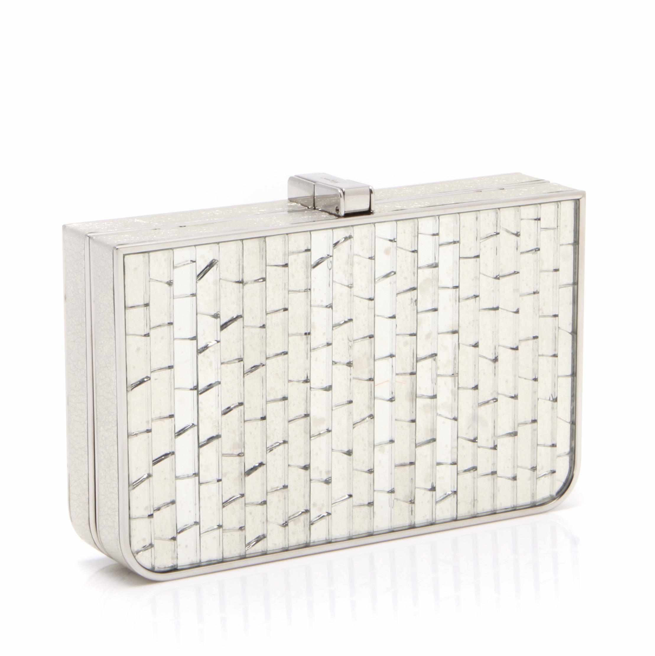 Appraisal: A Salvatore Ferragamo silver metal and mirrored clutch with silver