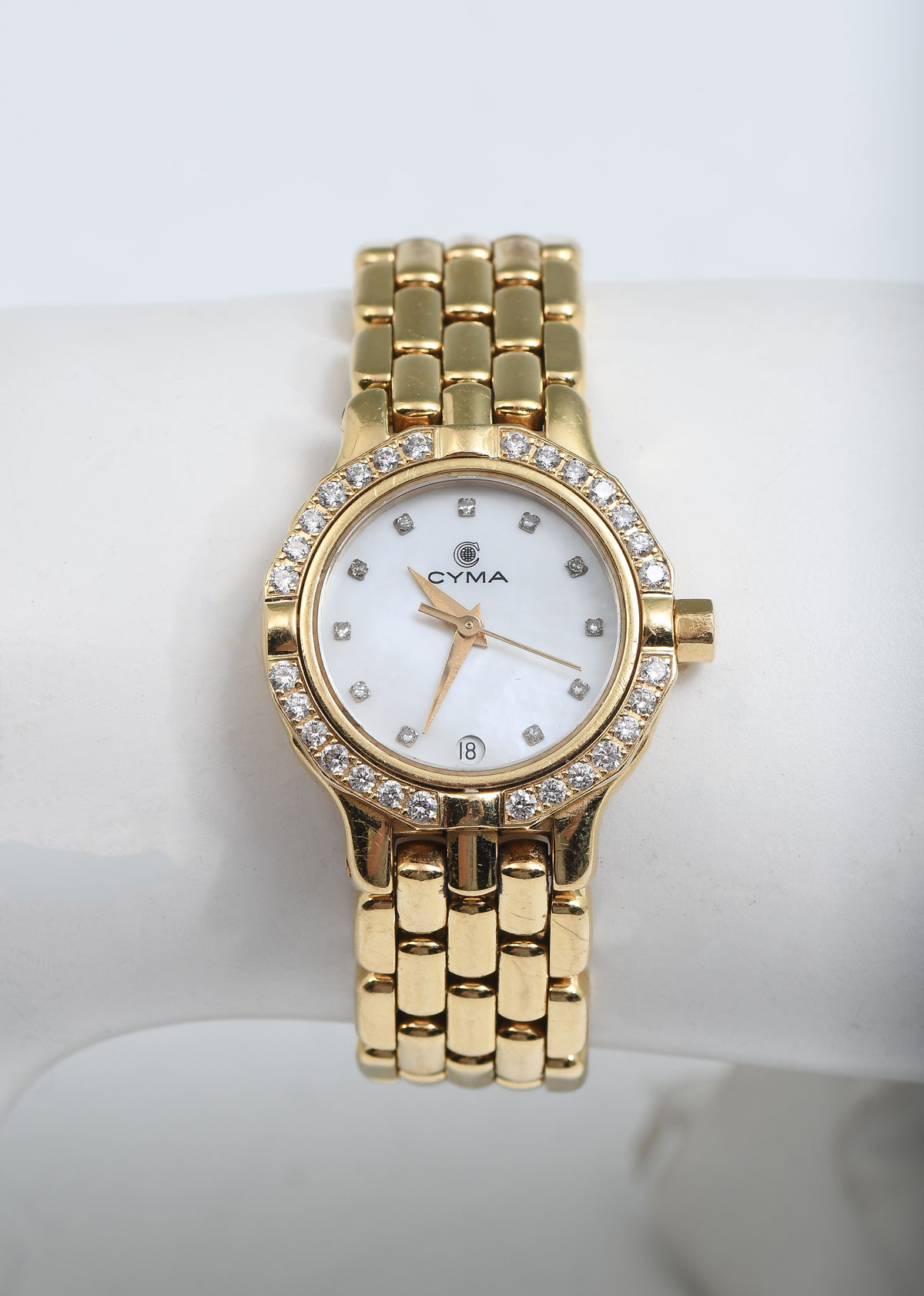 Appraisal: K CYMA WATCH WITH DIAMOND BEZEL K yellow gold round