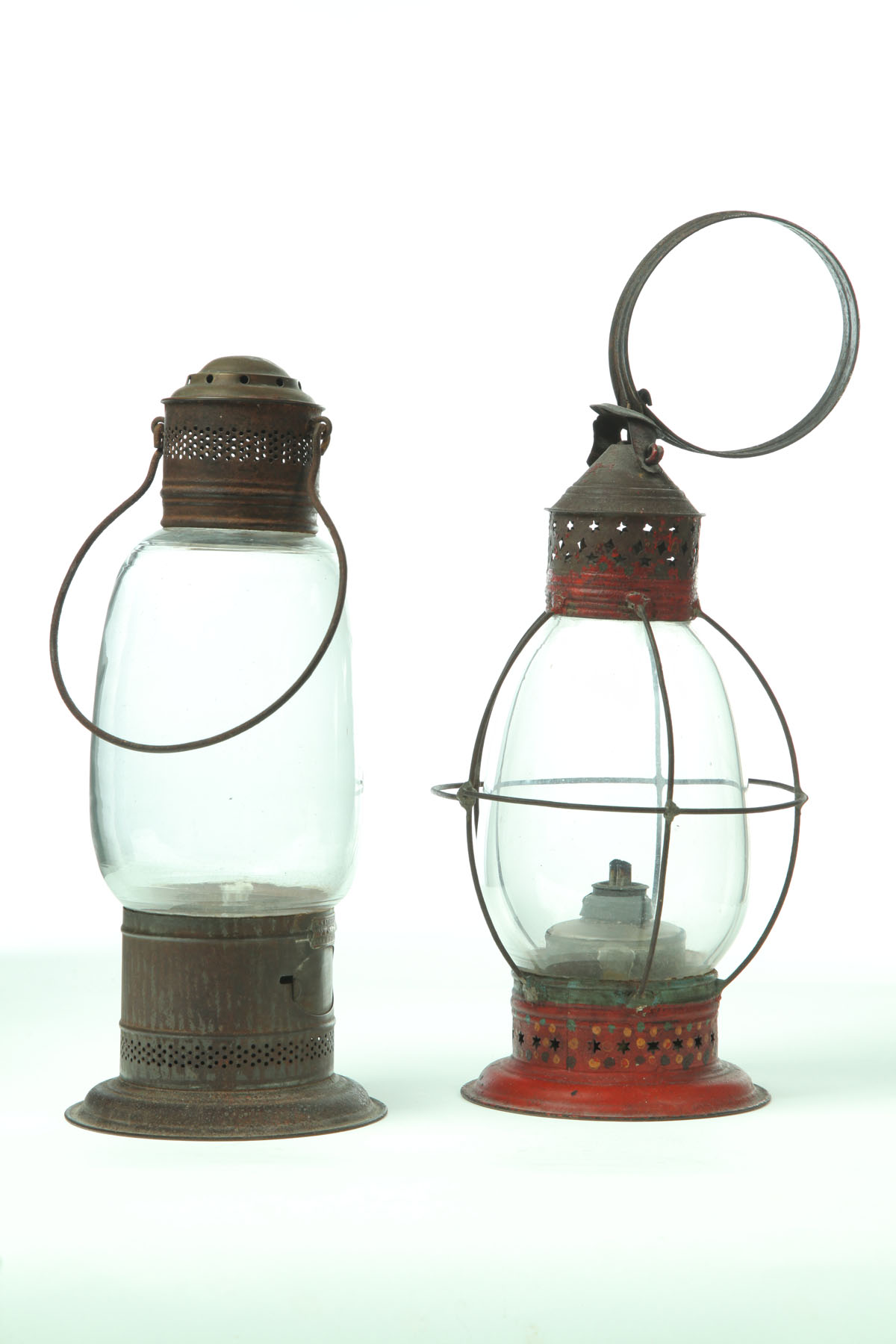 Appraisal: TWO LANTERNS American mid th century tin and glass Oblong