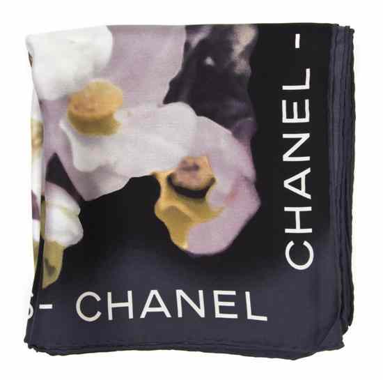 Appraisal: A Chanel Black Silk Scarf in a camellia motif Labeled