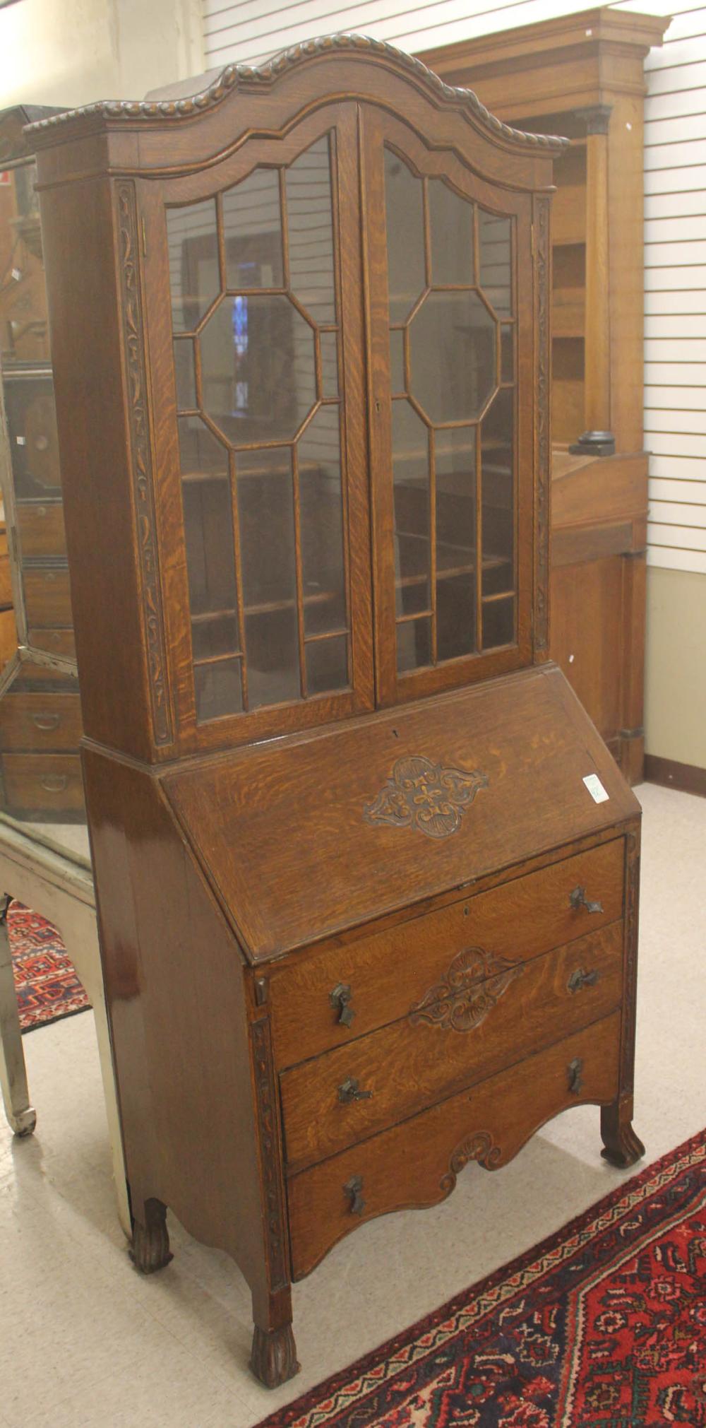 Appraisal: CARVED OAK SLANT-FRONT SECRETARY BOOKCASE English c H x W