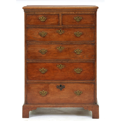 Appraisal: An oak chest of drawers th c the crossbanded moulded