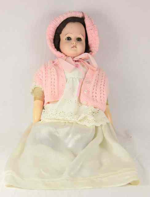 Appraisal: A bisque head doll with brown eyes and composition body