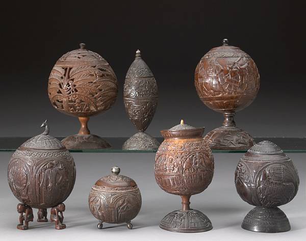 Appraisal: Seven Asian coconut footed containers with covers late th early