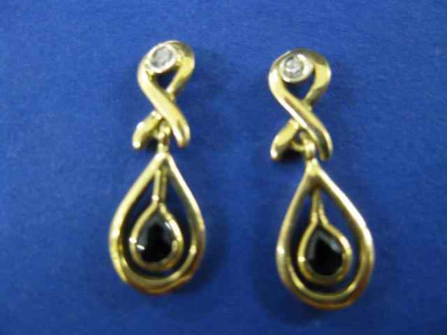 Appraisal: k Gold Sapphire Earrings two pear shaped gems totaling carat