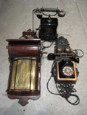 Appraisal: Three vintage telephones A wall mounted mahogany and brass hotel