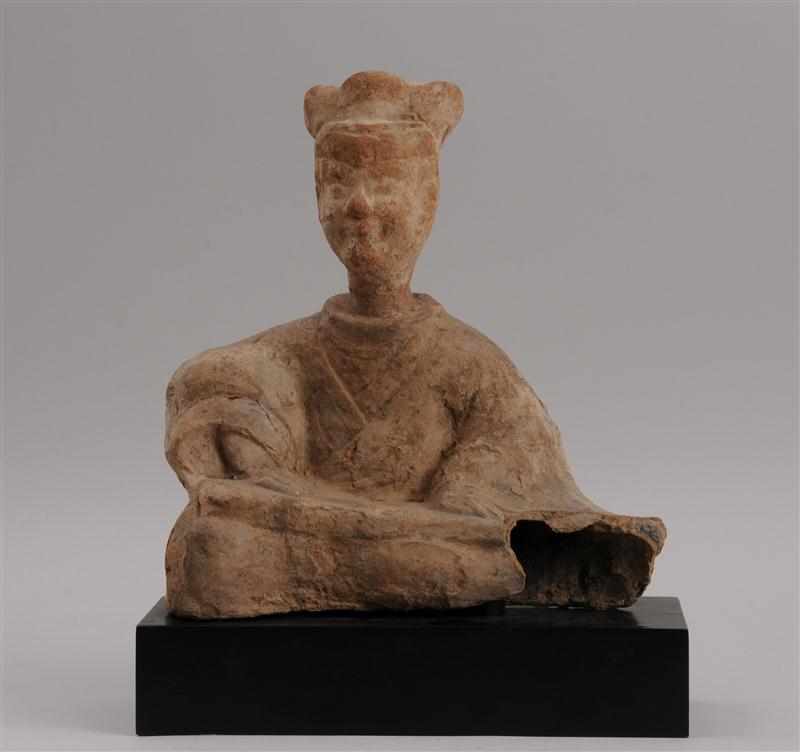 Appraisal: HAN POTTERY FIGURE OF A MUSICIAN Hollow cast modeled seated