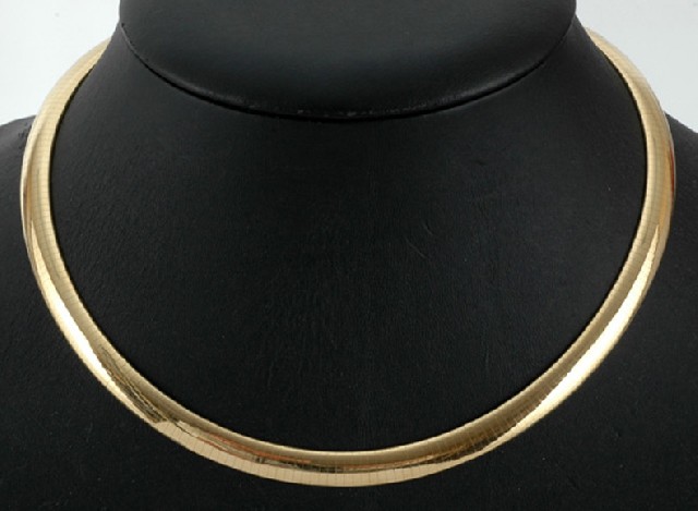 Appraisal: A gold omega collar The wide convex collar in ct