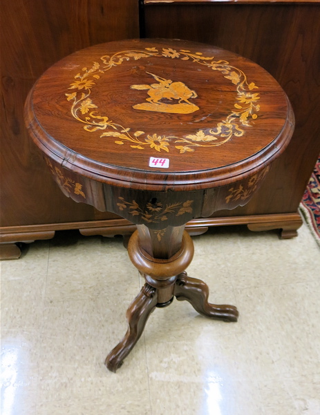 Appraisal: A VICTORIAN MARQUETRY INLAID ROSEWOOD SEWING TABLE American th century