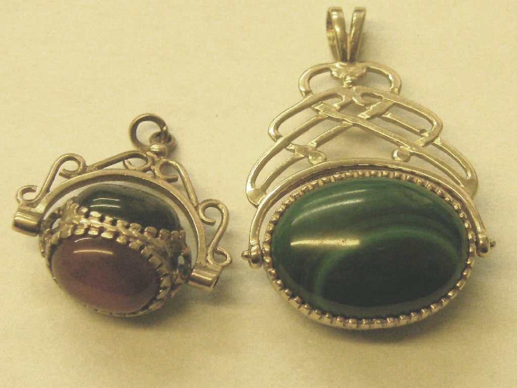 Appraisal: Two ct stone set swivel pendant fobs