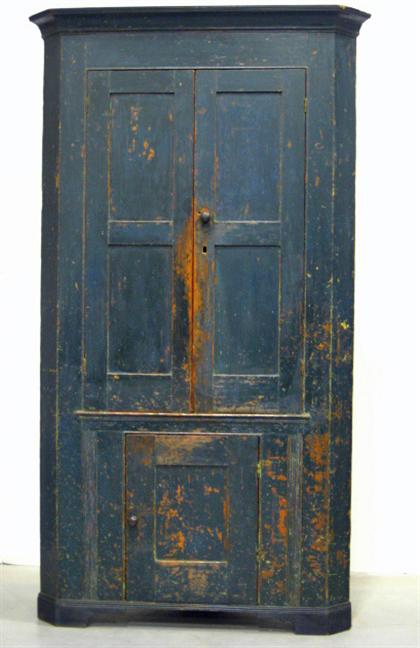 Appraisal: Blue painted corner cupboard Flat reeded and coved molded corners