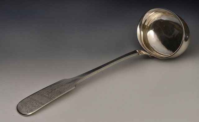 Appraisal: A NORWEGIAN SILVER LADLE with stylised bowl and chased decoration